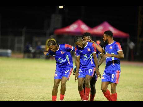 Credit: Nicholas Nunes/Photographer
Dunbeholden players celebrate scoring a goal against Humble Lion FC in a Jamaica Premier League fixture at the JC Ashenheim Stadium last month.