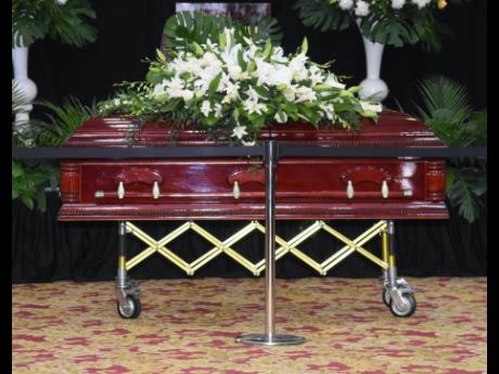 Credit: Ashley Anguin/Photographer The coffin bearing the remains of the late former custos of St James, Ewen Corrodus, at the thanksgiving service on Sunday.