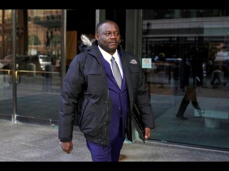 Former Haitian Mayor Jean Morose Viliena departs federal court, Monday, in Boston. Viliena, a lawful permanent resident of the US, was sued by three Haitian citizens who say they or their relatives were persecuted by him and his political allies. 