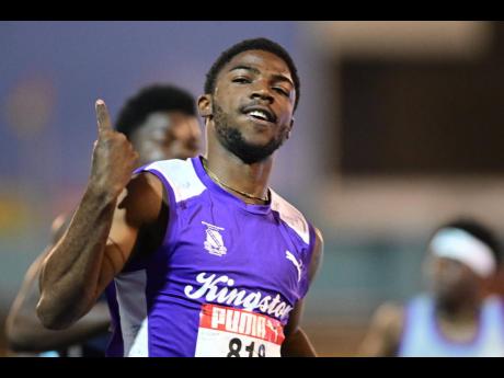 Credit: Gladstone Taylor Kingston College's (KC) Bouwahjgie Nkrumie celebrates after breaking the Class One boys' 100 metres record at the ISSA/GraceKennedy Boys and Girls' Athletics Championships at the National Stadium on tonight. The final is set for later tonight.