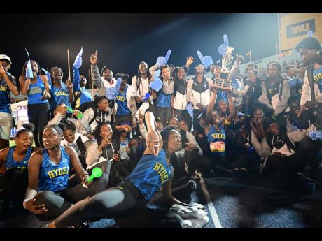 Hydel members celebrate after securing a two-point victory over defending champions Edwin Allen to claim the Games Mistress Trophy at the ISSA/GraceKennedy Boys and Girls' Athletics Championships at the National Stadium tonight.