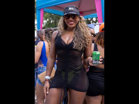 Attorney-at-law and trainer Liane Chung looks stunning in her black cover-up and shades.