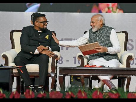 Prime Minister of India Narendra Modi (right) with Guyanese President Dr Mohamed Irfaan Ali at the 17th Pravasi Bharatiya Divas Convention - observed to mark the contribution of the overseas Indian community to the development of India - in Indore.