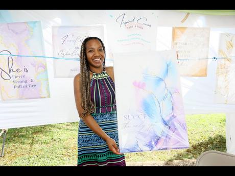 Leshana Campbell, owner of Inspired Canvas, displays her work.