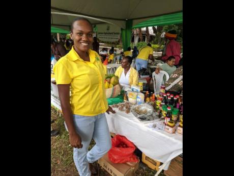 Tiffany Moorhouse, the JAS parish manager for Trelawny, at one of the booths at the Montpelier Agricultural Show in St James on Easter Monday.
