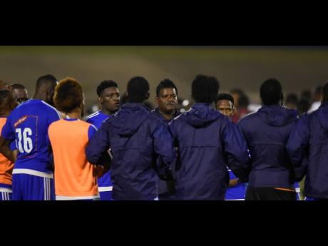 
Donovan Duckie (centre) speaks to players from the Mount Pleasant Academy during the 2019 edition of the Jamaica Premier League.