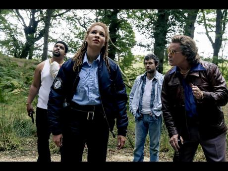 Credit: Contributed This image released by Universal Pictures shows (from left) O'Shea Jackson, Jr., Ayoola Smart, Alden Ehrenreich and Ray Liotta in a scene from 'Cocaine Bear'.