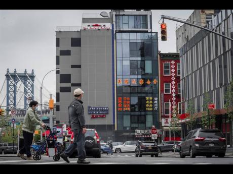 A six-storey glass façade building (centre), is believed to be the site of a foreign police outpost for China in New York’s Chinatown.