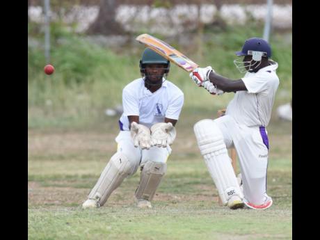 Excelsior High School’s David Dewar (right) plays a paddle sweep on his way to 51 against Kingston College in an ISSA Urban T20 game at the Excelsior High School cricket field yesterday. Looking on is Kingston College wicketkeeper, Steven Wedderburn.