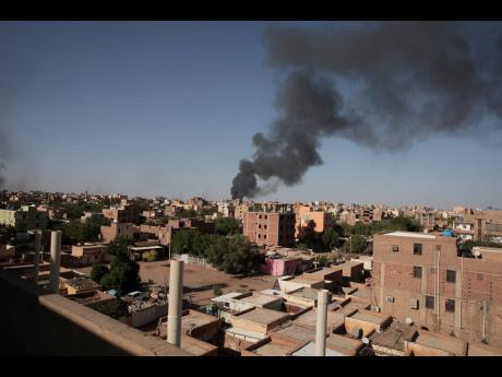 Smoke is seen in Khartoum, Sudan on Wednesday. Terrified Sudanese are fleeing their homes in the capital Khartoum, witnesses say, after an internationally brokered ceasefire failed and rival forces battled in the capital for a fifth day. 
