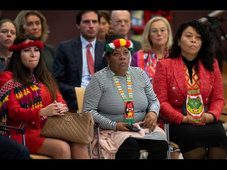 
Invited guests listened when Dutch Prime Minister Mark Rutte apologised on behalf of his government for the Netherlands’ historical role in slavery and the slave trade at the National Archives in The Hague, on December 19, 2022. 