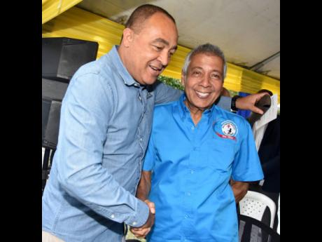 
Minister of Health and Wellness Dr Christopher Tufton greets Kenneth Benjamin, chairman of the management committee at the Bustamante Hospital for Children.
