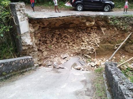 Credit: Contributed The Woodsville bridge in eastern Hanover which recently collapsed. As authorities continue to bicker, residents took matter in their hands and build a makeshift structure.