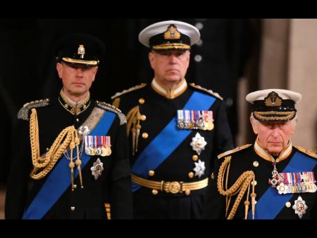 King Charles III, Prince Andrew and Prince Edward arrive to attend a vigil for late Queen Elizabeth II, lying in state on the catafalque in Westminster Hall, at the Palace of Westminster in London, on September 16, 2022. 