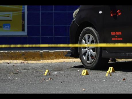 Bullet casings riddled at a crime scene in Portmore Pines Plaza where a team of security guards from Beryllium were attacked and robbed in February.