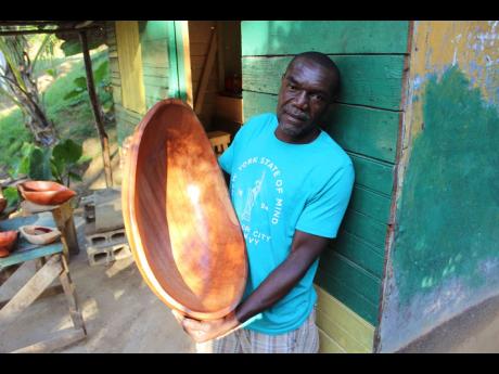Credit: Paul H. Williams Winston Joseph of Aleppo, St Mary displays one of his bigger bowls made from cedar wood.