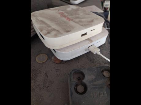 Credit: Andre Williams A customer with two cable boxes. The top box has been disconnected for over a year. The box at the bottom is ‘cable for life box’. Once connected to the mesh router, the customer is able to watch mutiple channels.