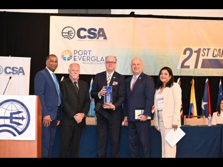 Mayor of Broward County Lamar P. Fisher (centre) and Port Everglades CEO and port director Jonathan T. Daniels (second right) accept a token from the Caribbean Shipping Association’s executives (from left) Vice-President William Brown; President Marc Sam