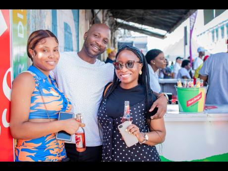 Three friends, two beers, a good party of five! From left: Our lens caught Tracy-Ann Granston, Allan Ismail and Jodi-Ann Pryce having a good time.