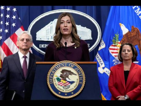 DEA Administrator Anne Milgram (centre) flanked by Attorney General Merrick Garland and Deputy Attorney General Lisa Monaco, speaks during a news conference at the Justice Department in Washington, last month. 