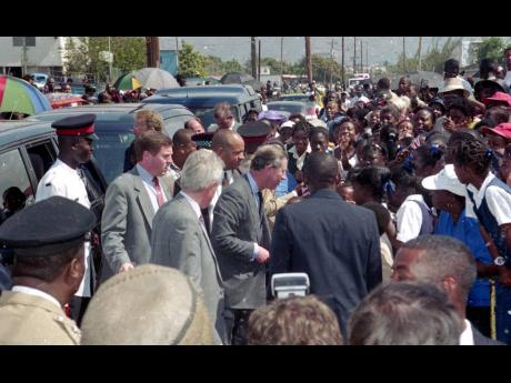 Credit: Gleaner Archives Charles, Prince of Wales, is greeted by a throng of residents from Trench Town as he arrives at the Trench Town Culture Yard and Village on Tuesday, February 29, 2000.