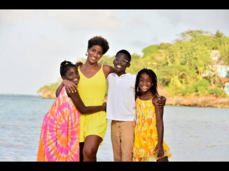 Imani Duncan-Price (second left) with her children (from left) Marley, (who is now 10 years old), Aidan, (now 12) and Selah, 7 years old.