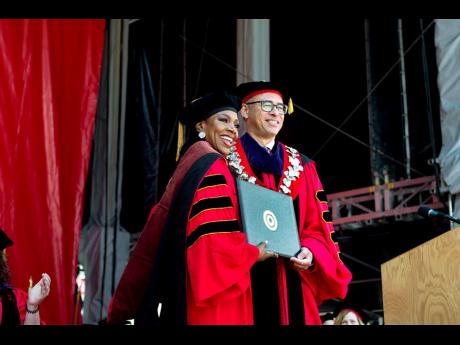 Jonathan Holloway, president of Rutgers, The State University of New Jersey, presents the honorary doctorate of fine arts to Dr Sheryl Lee Ralph.