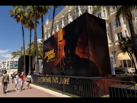 Credit: AP The official poster for ‘Indiana Jones and the Dial of Destiny’ is pictured outside the entrance of the Carlton hotel ahead of the Cannes film festival, in Cannes, southern France.