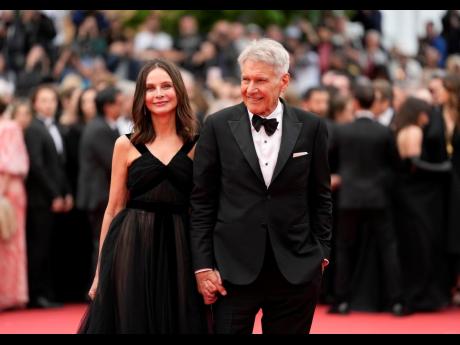 Credit: AP Calista Flockhart (left) and Harrison Ford pose for photographers upon arrival at the première of the film ‘Indiana Jones and the Dial of Destiny’ at the 76th international film festival, Cannes, southern France.
