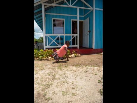 Cetterber Sitcheran, outside her new home in Little London, Westmoreland. 
