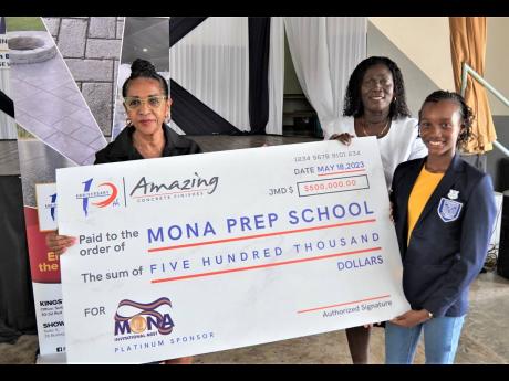 Credit: Contributed Angela Amir (left), director, Amazing Concrete Finishes Limited, presents a sponsorship cheque for $500,000 to Citrine Dixon (centre), acting principal of Mona Prep, and Soleil Blake, head girl and track team member. The presentation took place during yes