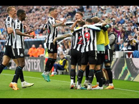 Credit: AP Newcastle United celebrate after Brighton and Hove Albion’s Deniz Undav scored an own goal during the English Premier League match at St James’ Park, Newcastle, England, yesterday