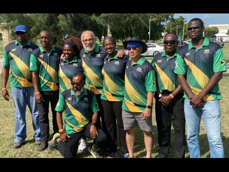 From left: Dr Derek Mitchell, Phillip Scott (captain), Nicola Guy, Major John Nelson, Karen Anderson, Denis Lee, Canute Coley and Dwayne Ford. Kneeling in front is George Sutton.