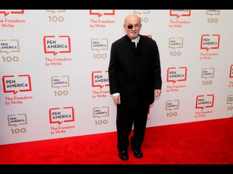 Rushdie walked the red carpet for his  first in-person appearance at a public event since he was attacked last August while onstage at a literary festival in western New York.