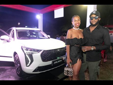 Social media influencers, Kristia Franklin (left) and Kareem ’BwoyaTingz’ Weathers were spotted during the launch of the new Great Wall Motor (GWM) Havals at the Hope Botanical Gardens in Kingston.