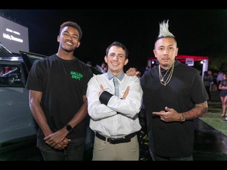 GWM business development manager, James Stewart Lechler (centre) strikes a pose with Youtubers Chad Luchey (left) and Nick Lue, brand ambassador for Automotive Art Jamaica.