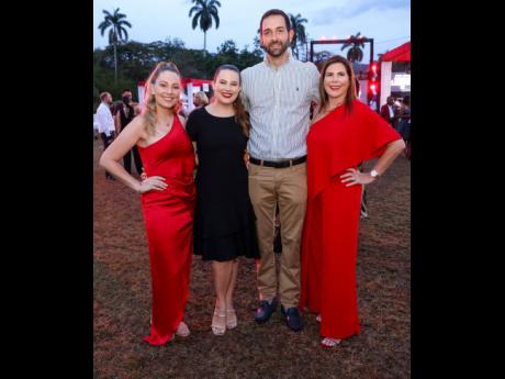From left: Stewart’s Automotive Group’s head of operations, Christina Hudson; Brand sales manager, Amanda Issa; and developer, Peter Issa, strike a pose with Stewart’s Automotive Group’s managing director, Jackie Stewart.