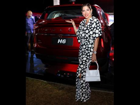A stylish pair! Gaby Malatino shows off the bold and sleek GWM Haval H6. 