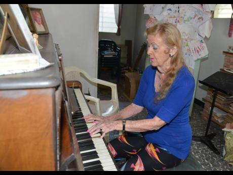 Patricia Gooden plays the piano in her home on Waterloo Road in Kingston. 