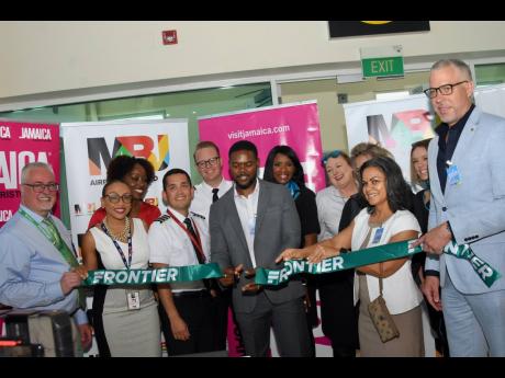Credit: Ashley Anguin Deputy Mayor of Montego Bay Richard Vernon (centre) at the official ribbon-cutting ceremony to celebrate Frontier Airlines’ inaugural flight from Dallas-Fort Worth International Airport in Dallas, Texas, to the Sangster International Airport in Montego B