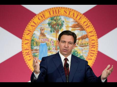 FILE - Florida Gov Ron DeSantis speaks during a news conference to sign several bills related to public education and increases in teacher pay, in Miami, on May 9.
