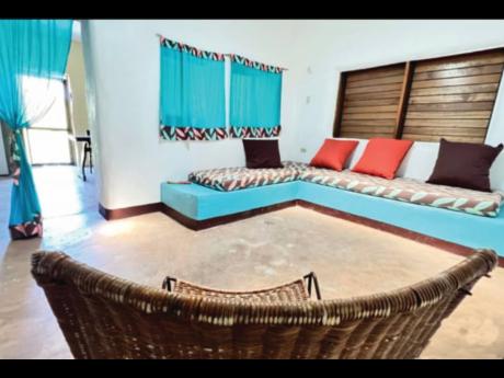 The living area of this St Thomas house, with custom-made concrete, upholstered seating.