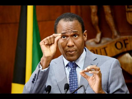 Dr. Nigel Clarke, minister of finance and the public service,  speaks at the post cabinet press briefing at Jamaica House in Kingston on May 24.