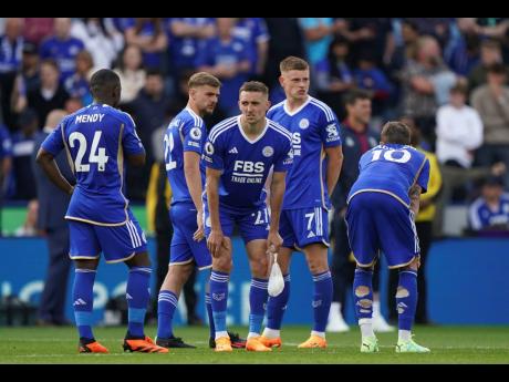 Leicester City players wait to find out the results at other games after the English Premier League  match between Leicester City and West Ham United at King Power Stadium, Leicester, England, yesterday. 
