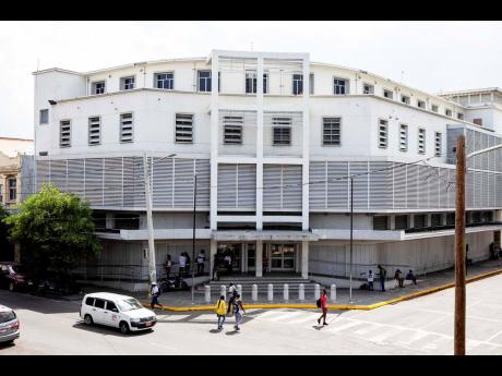 Credit: File File photo shows people walking by the Supreme Court and Court of Appeal building in downtown Kingston. A rare judgment was passed in the Court of Appeal, on Monday, to overturn a ruling by the General Legal Counsel.