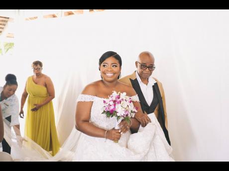 On her way to becoming Mrs Stevens, the beautiful bride is escorted up the aisle by her father, Patrick Boodie. 