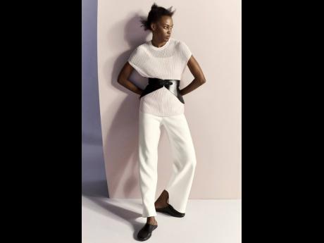Listed among the world’s top 50 models, Kai Newman is photographed in the sheer rib cap-sleeve top, corset belt and ankle pant from Fforme.
