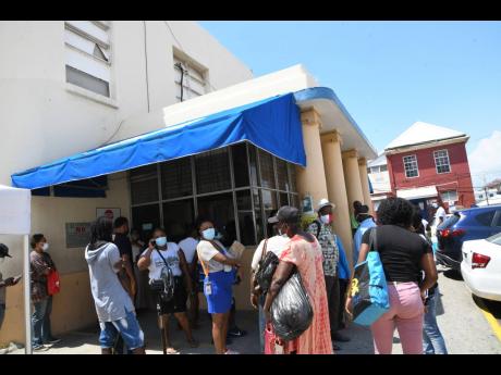 
In this March 2021 photo visitors are seen at Kingston Public Hospital. 