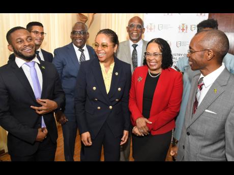 Marlene Mahaloo-Forte, (centre) minister of legal and constitutional affairs, with members of the Constitutional Reform Committee (from left) Sujae Boswell, Richard Albert, David Henry, Hugh Small, Donna Scott-Mottley, and Rocky Meade.
