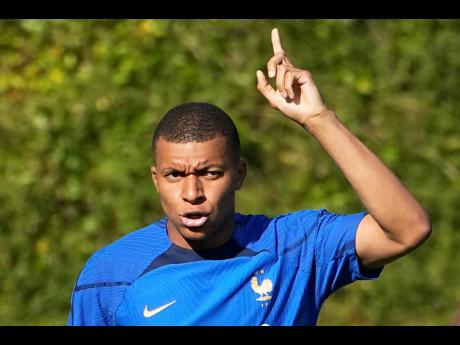 French football player Kylian Mbappé gestures during a training session with the French national team at its training centre in Clairefontaine, west of Paris yesterday.
